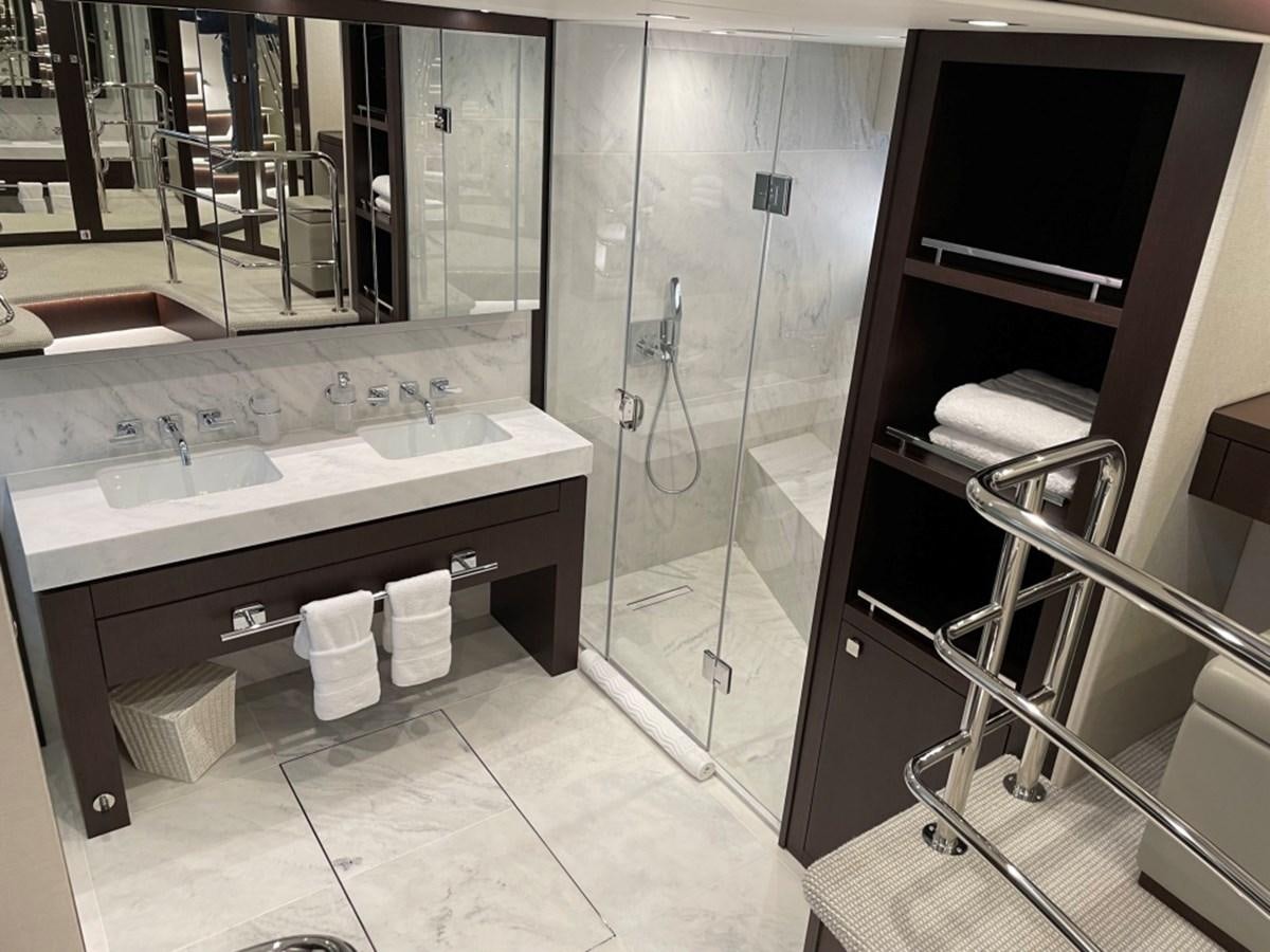 a bathroom with a glass shower aboard SUNSEEKER 95 Yacht for Sale