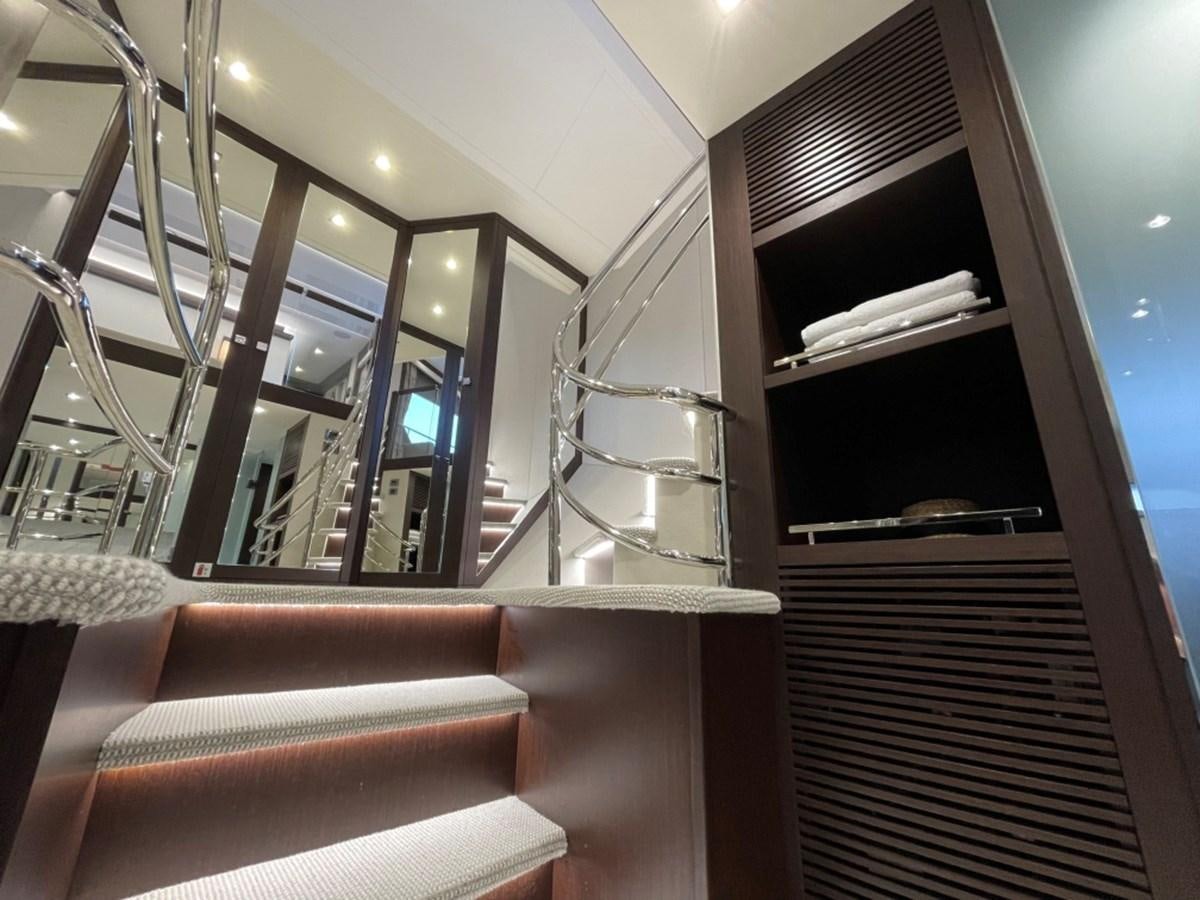 a staircase with a glass window aboard SUNSEEKER 95 Yacht for Sale