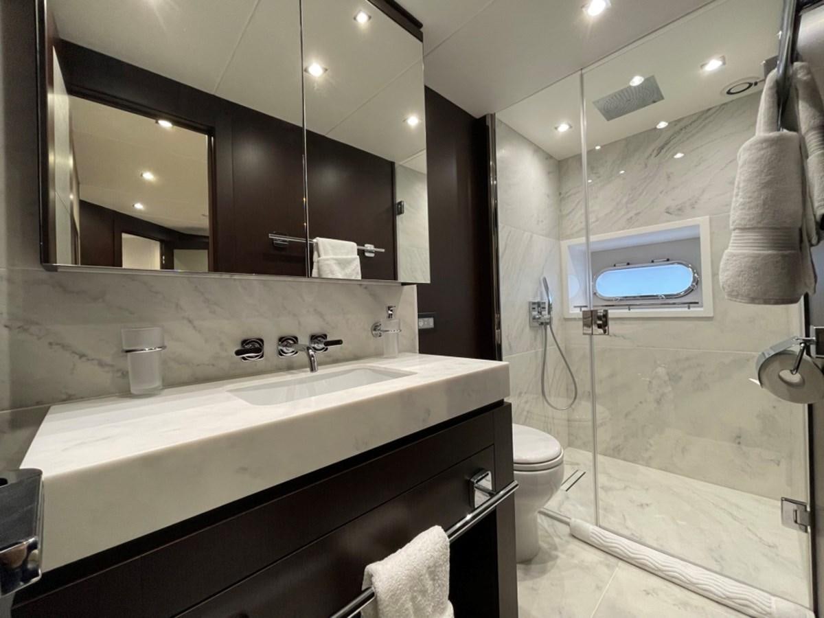 a bathroom with a large mirror aboard SUNSEEKER 95 Yacht for Sale