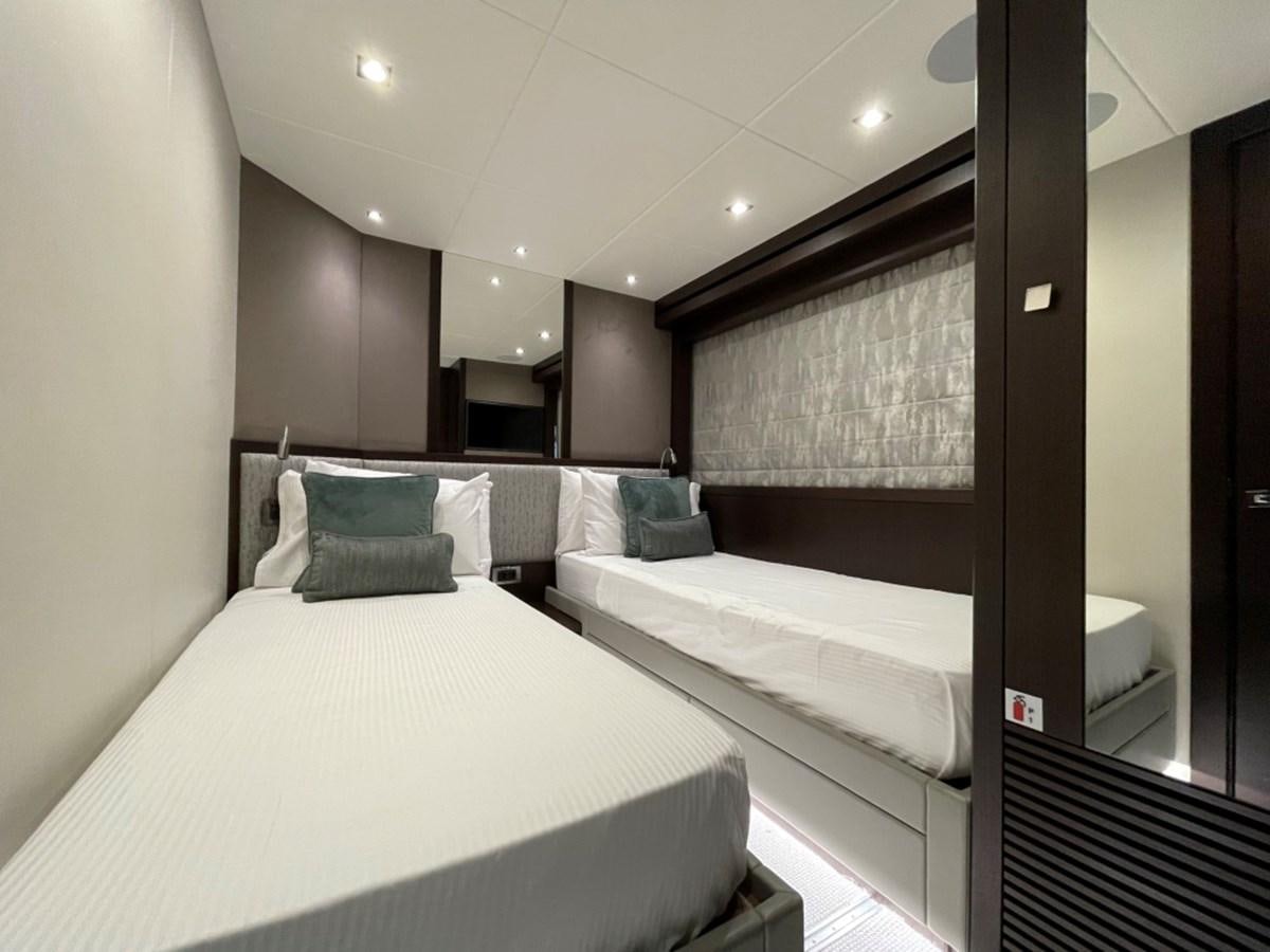 a room with a bed and a mirror aboard SUNSEEKER 95 Yacht for Sale