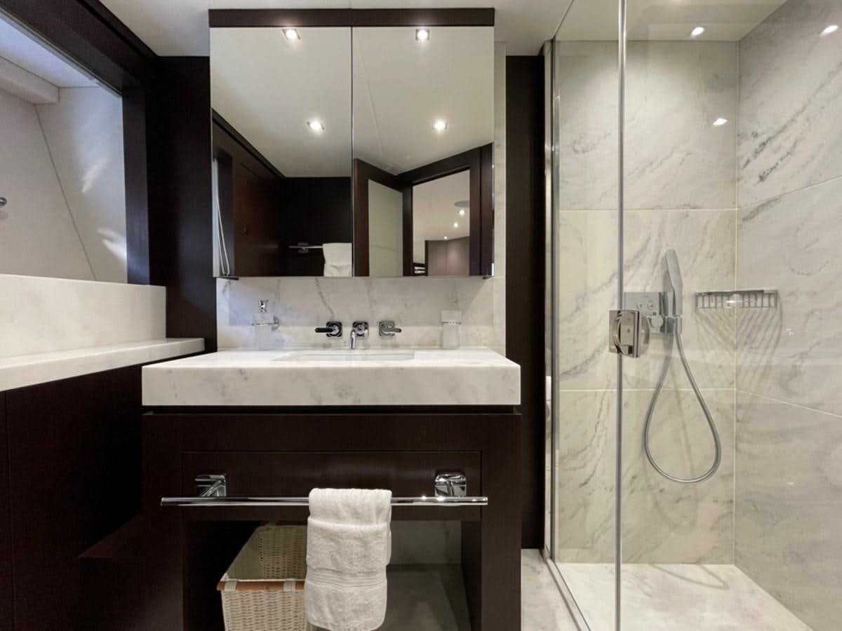 a bathroom with a sink and a mirror aboard SUNSEEKER 95 Yacht for Sale