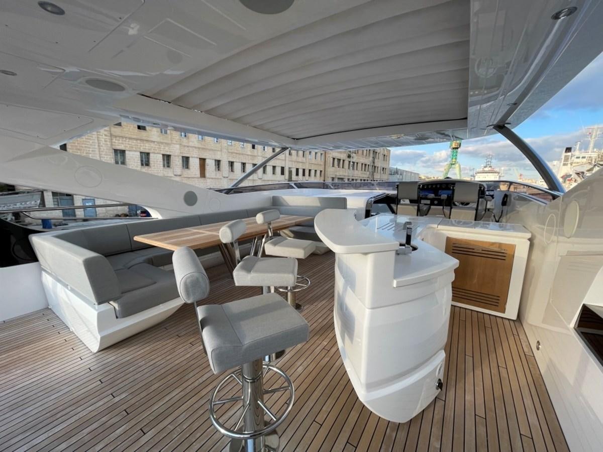 a room with a large white lounge chair and a large white boat aboard SUNSEEKER 95 Yacht for Sale