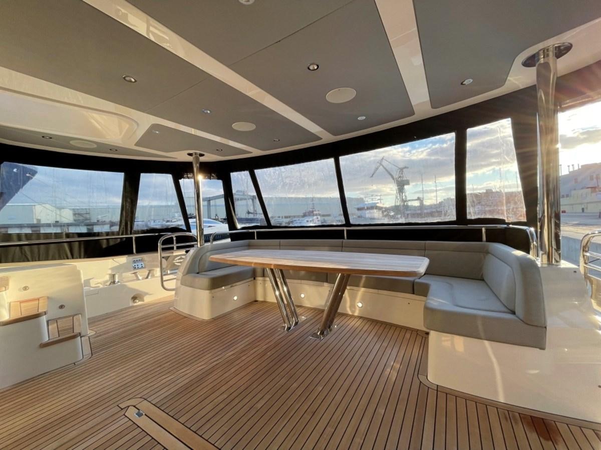 a room with a table and chairs aboard SUNSEEKER 95 Yacht for Sale