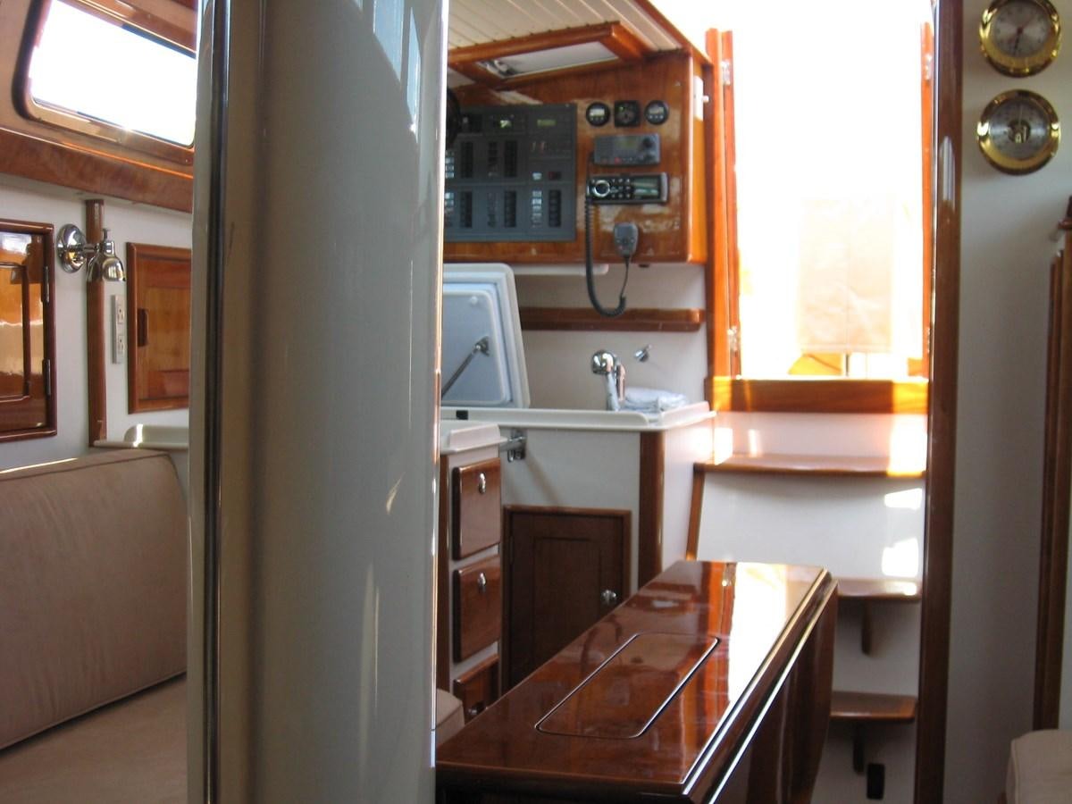 a kitchen with a sink and cabinets aboard BOADICEA Yacht for Sale