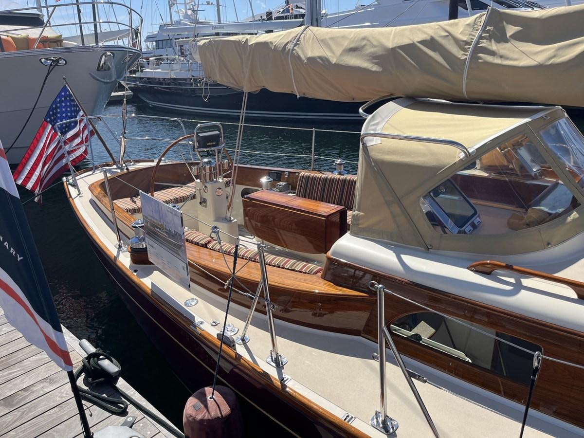 a boat with a flag on the front aboard BOADICEA Yacht for Sale