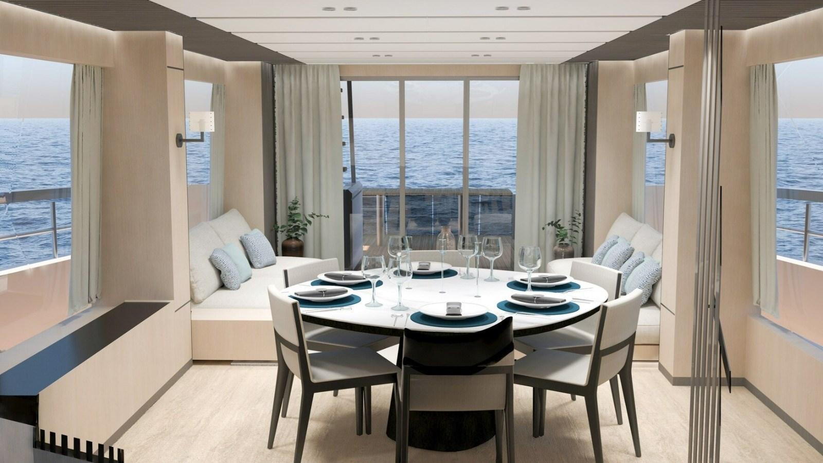 a dining room with a table and chairs aboard 2022 MENGI YAY  Yacht for Sale