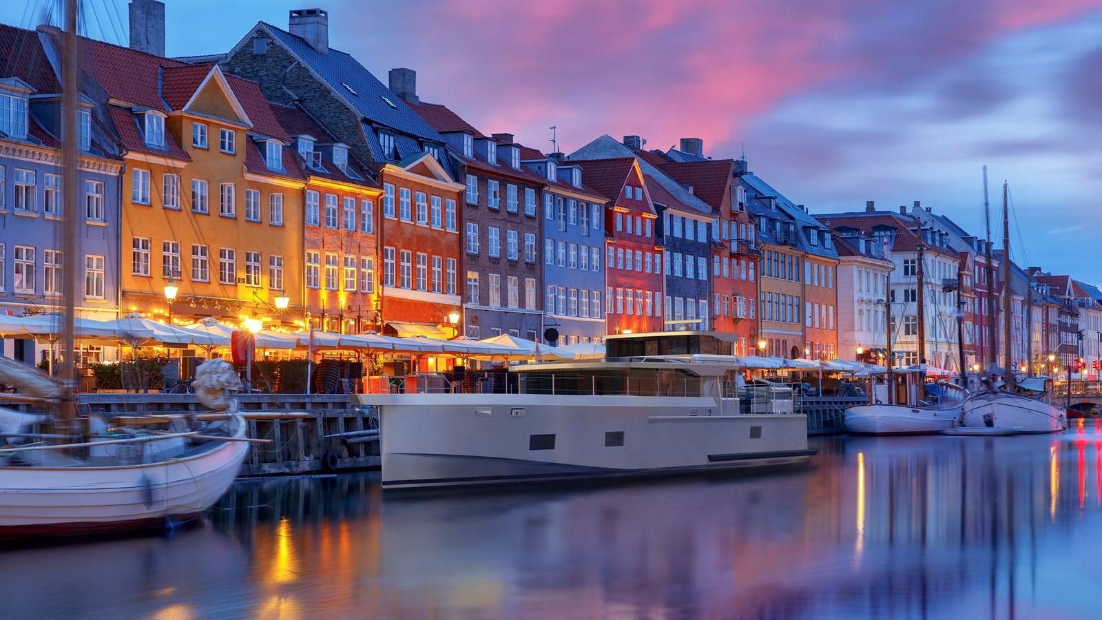 a boat docked at a pier aboard ARKSEN 65 Yacht for Sale