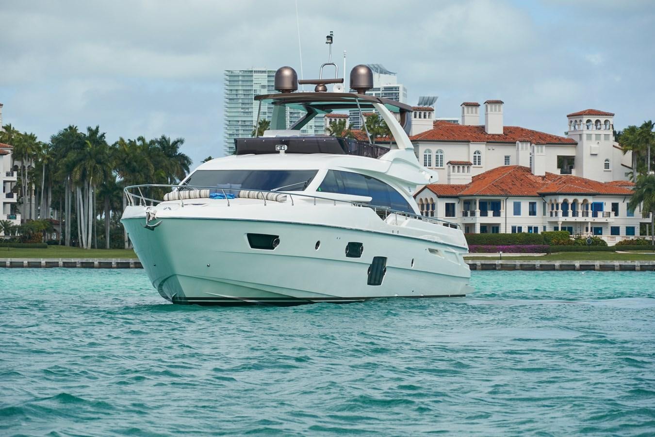 a white yacht in the water aboard Mojo Yacht for Sale