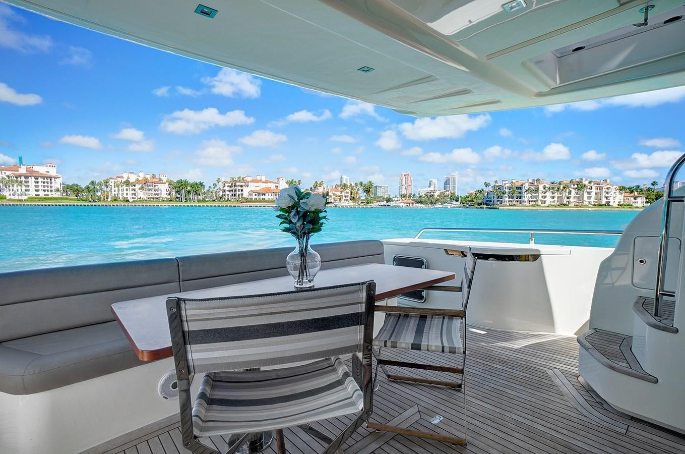 a table and chairs on a boat aboard Mojo Yacht for Sale