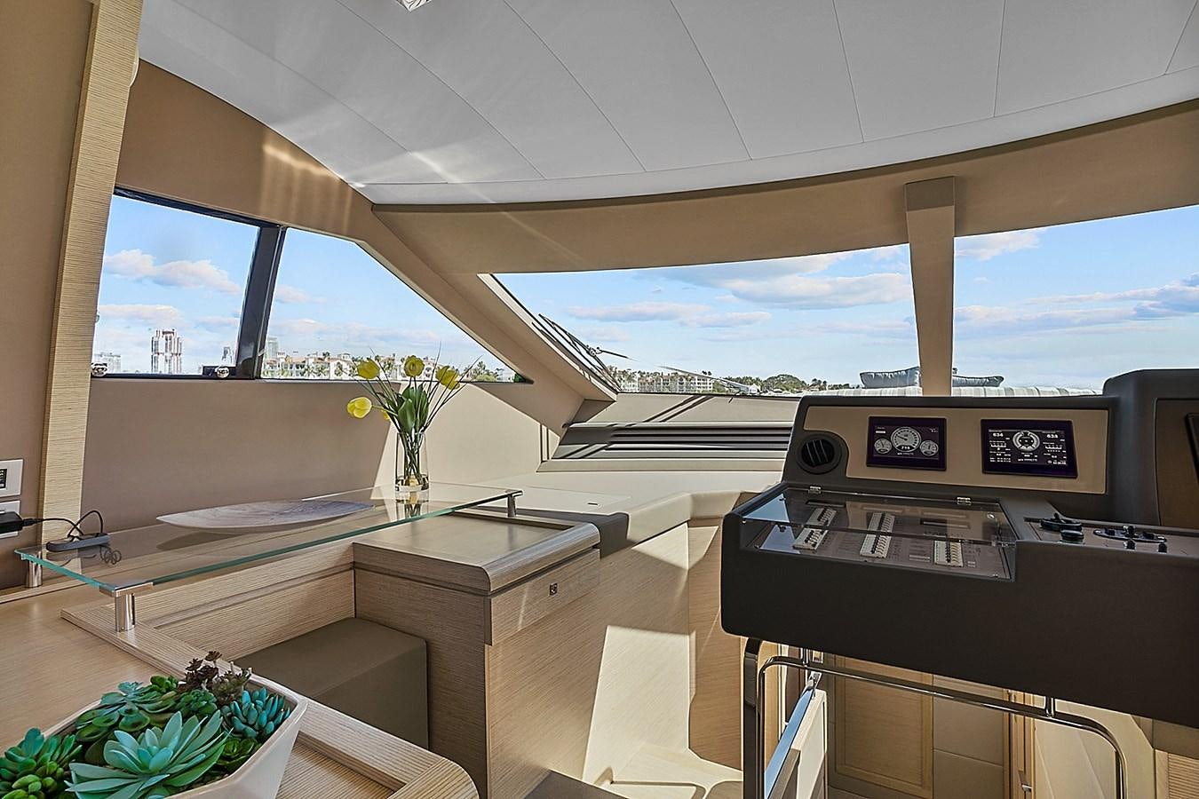 a room with a large window and a desk with a large window aboard Mojo Yacht for Sale