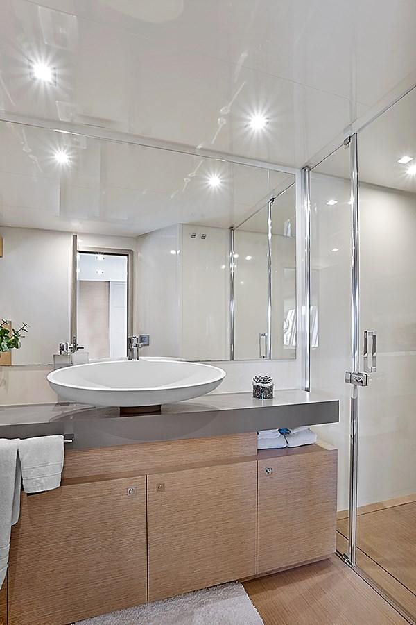 a bathroom with a large mirror aboard Mojo Yacht for Sale