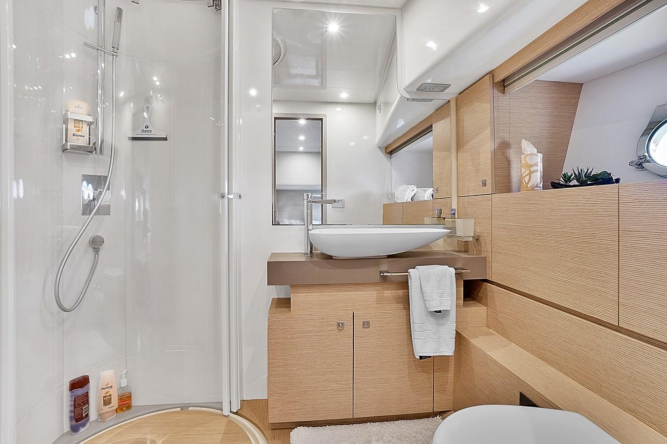 a bathroom with a shower and sink aboard Mojo Yacht for Sale