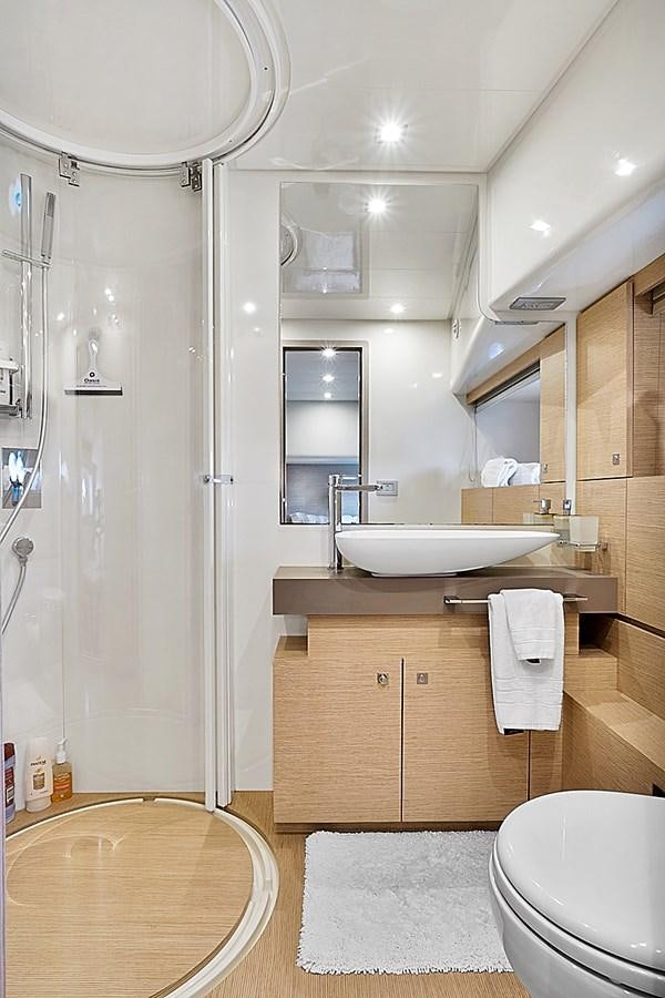 a bathroom with a sink and toilet aboard Mojo Yacht for Sale