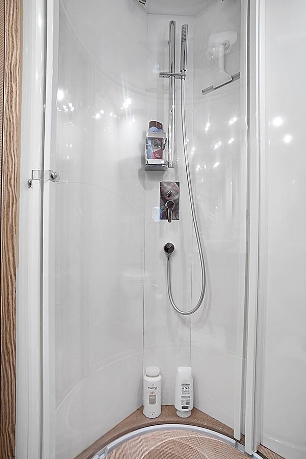 a shower with a glass door aboard Mojo Yacht for Sale