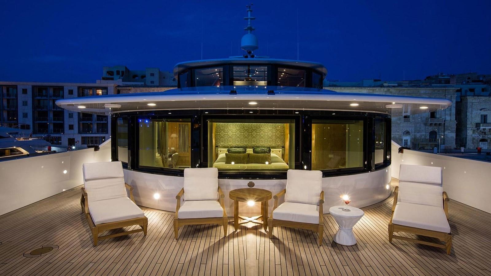 a large living room with a large open roof aboard SEAKID II Yacht for Sale