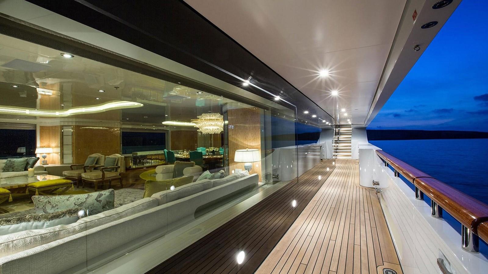 a large room with a deck and chairs aboard SEAKID II Yacht for Sale