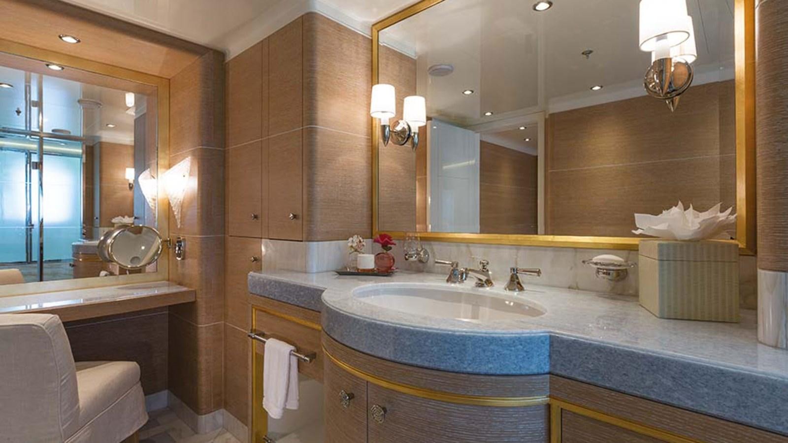 a bathroom with a large mirror aboard SEAKID II Yacht for Sale