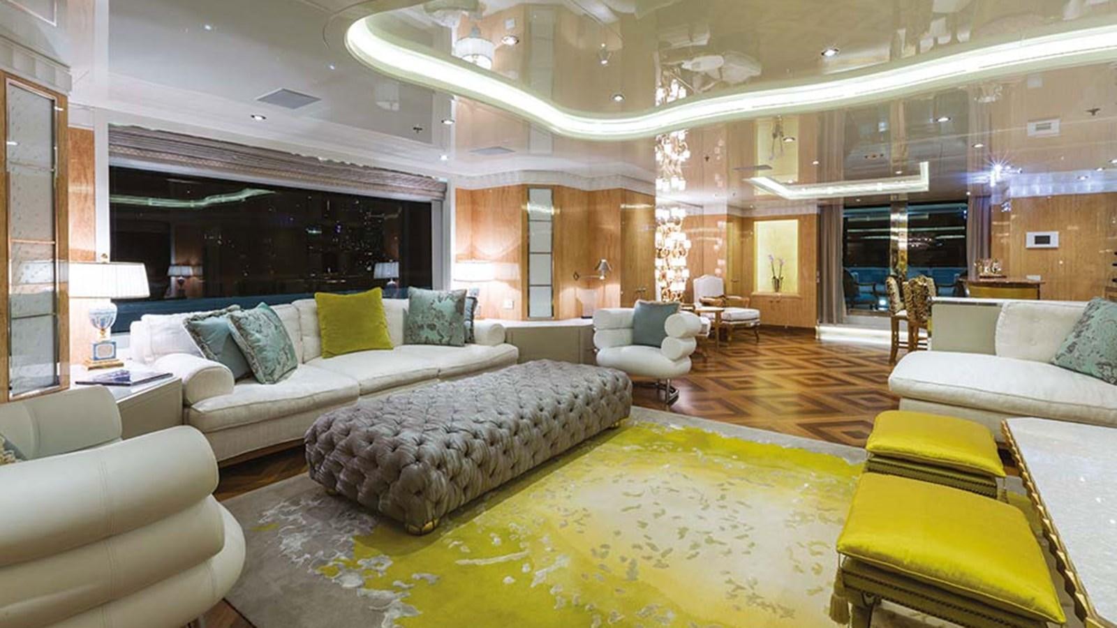 a large living room with a large bed and a large mirror aboard SEAKID II Yacht for Sale