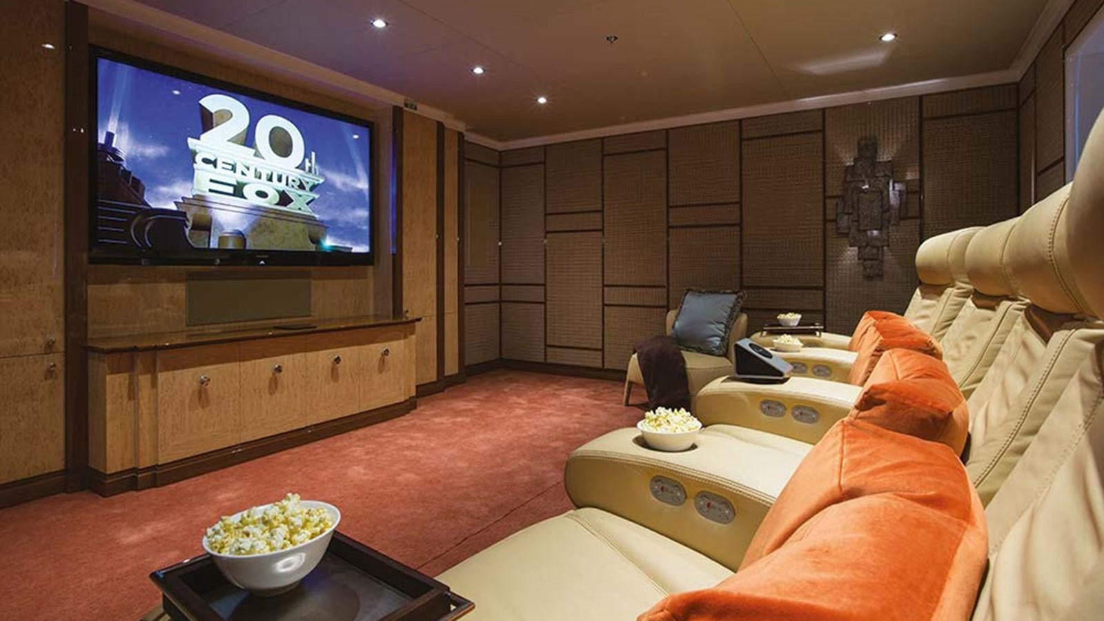 a living room with a tv and furniture aboard SEAKID II Yacht for Sale