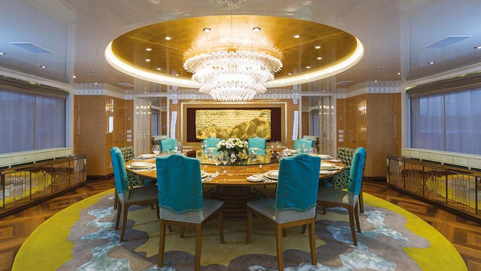 a room with a table and chairs aboard SEAKID II Yacht for Sale