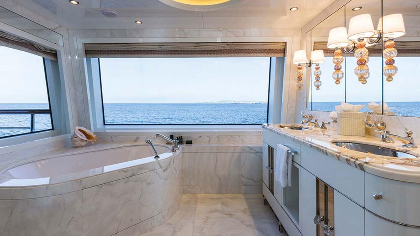a large bathroom with a large tub aboard SEAKID II Yacht for Sale