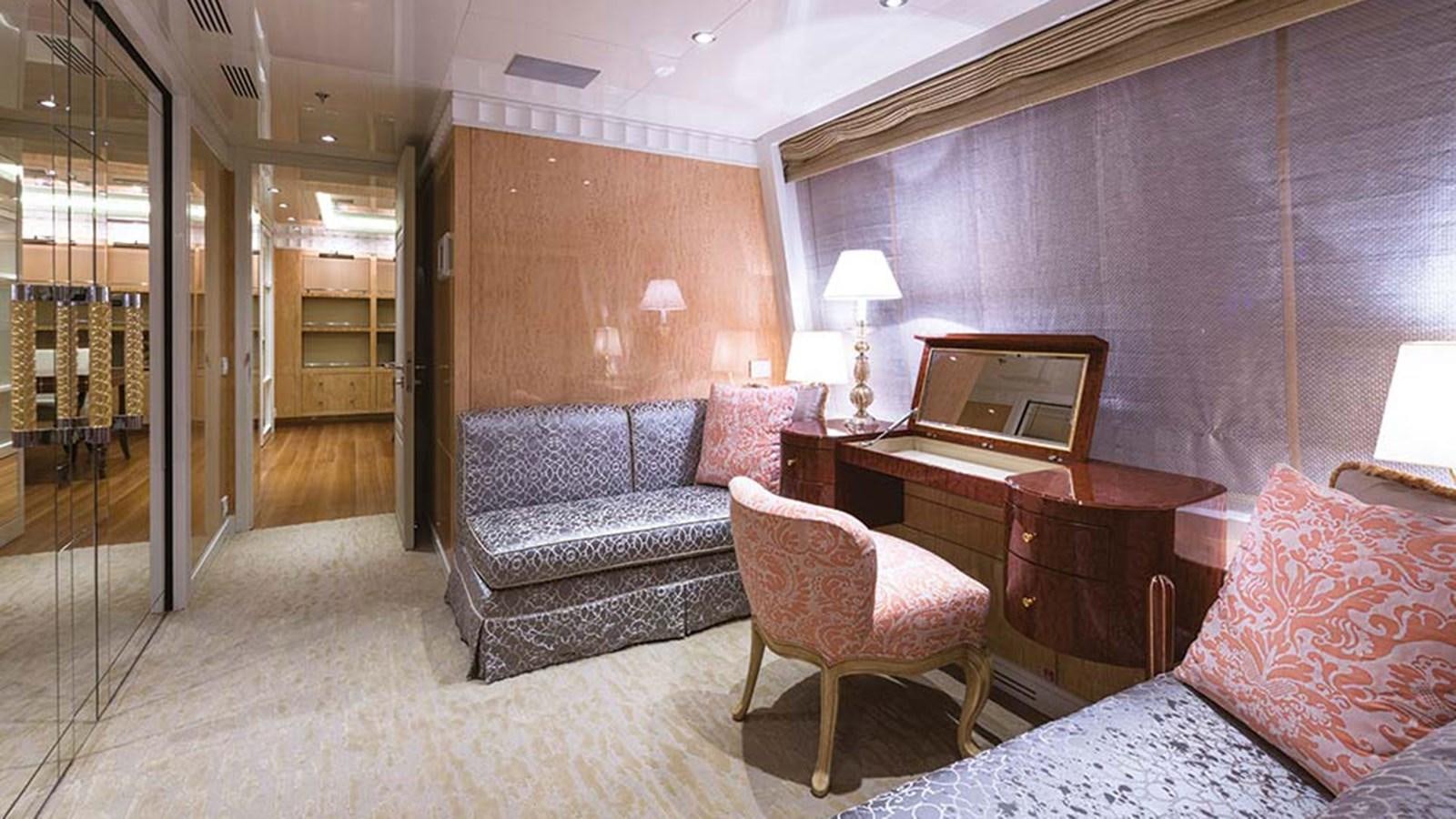 a room with a couch and a piano aboard SEAKID II Yacht for Sale