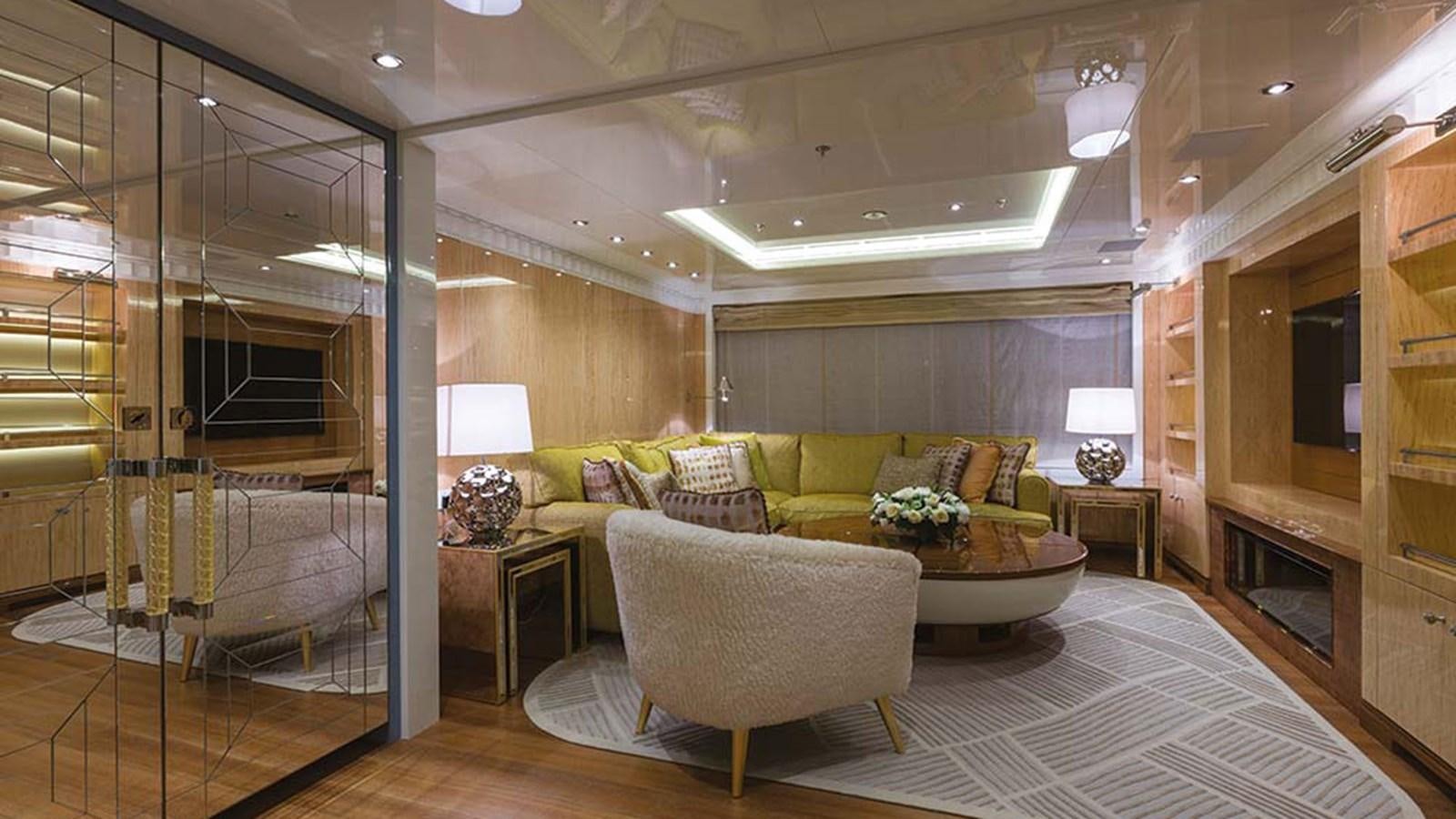 a living room with a large mirror aboard SEAKID II Yacht for Sale
