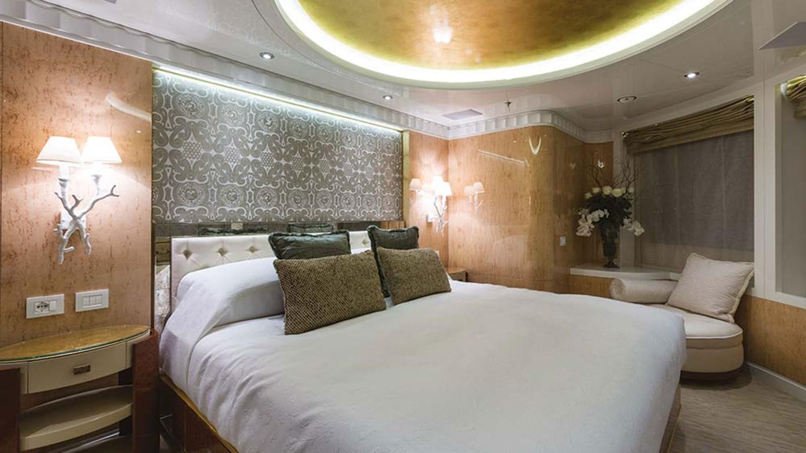 a room with a bed and a couch aboard SEAKID II Yacht for Sale