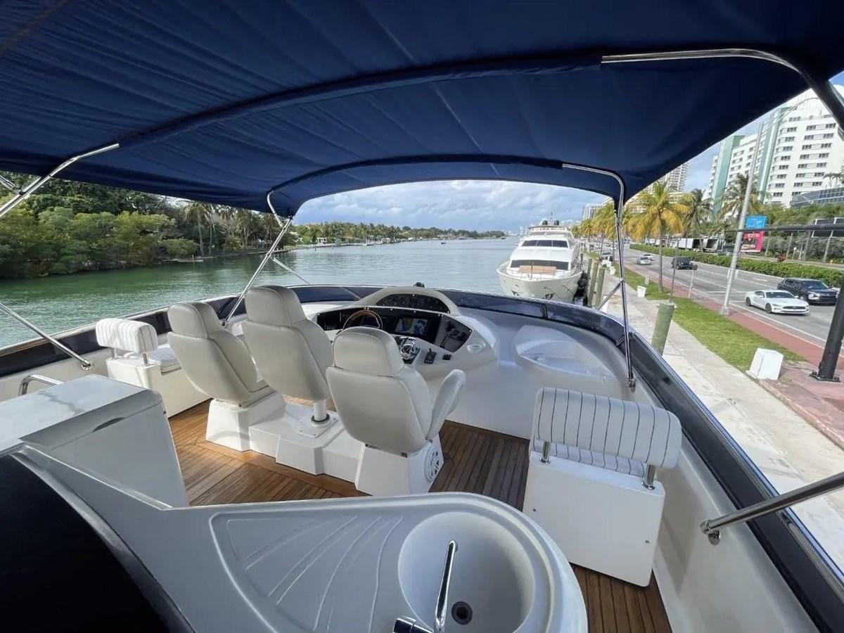 a car with a large windshield aboard 94 YACHT Yacht for Sale