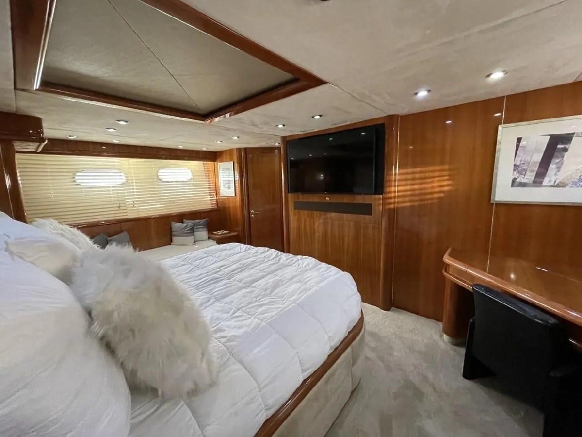 a room with a bed and a television aboard 94 YACHT Yacht for Sale
