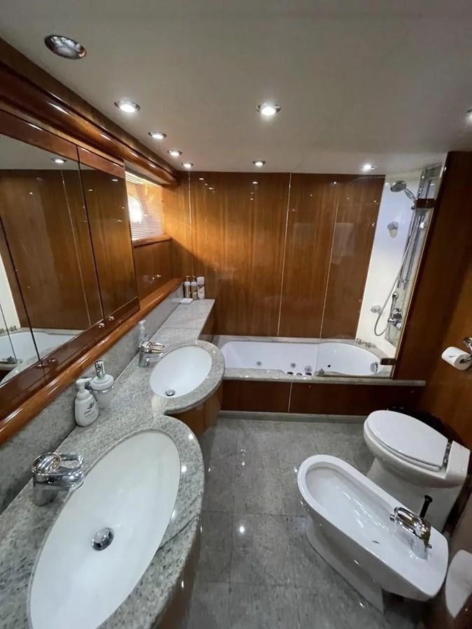 a bathroom with a tub sink and a sink aboard 94 YACHT Yacht for Sale