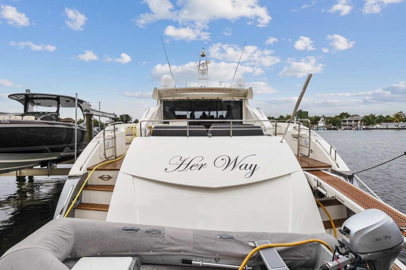 a boat docked at a pier aboard HER WAY Yacht for Sale