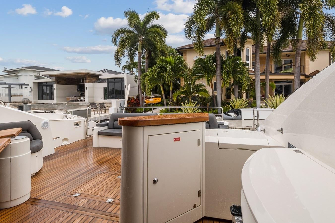 a deck with a pool and a deck with a pool and trees aboard HER WAY Yacht for Sale