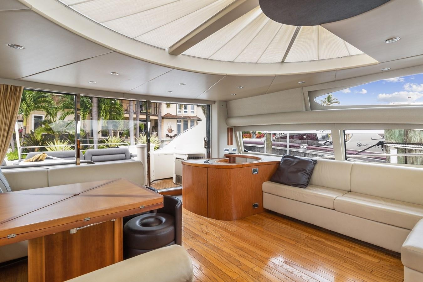 a room with a couch and a table and a window aboard HER WAY Yacht for Sale