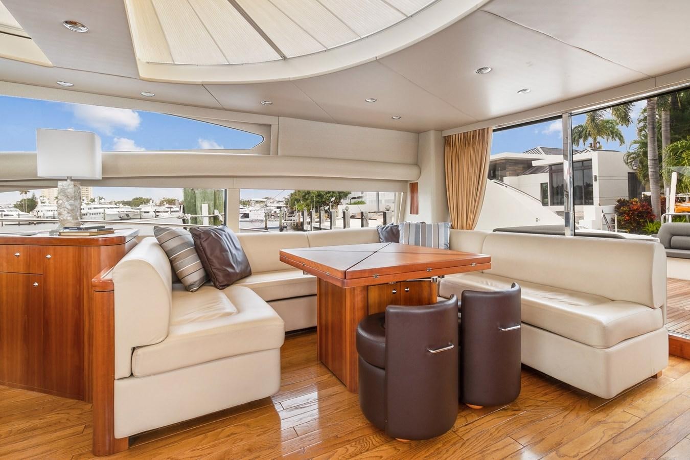 a living room with a couch and a table aboard HER WAY Yacht for Sale