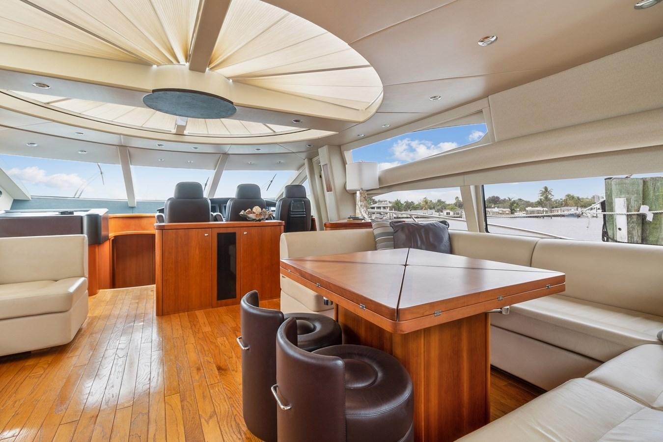 a room with a table and chairs aboard HER WAY Yacht for Sale