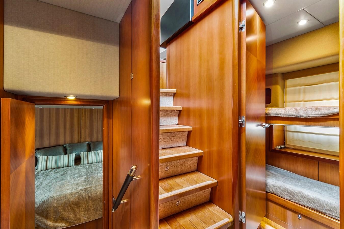a wooden staircase with a glass door aboard HER WAY Yacht for Sale
