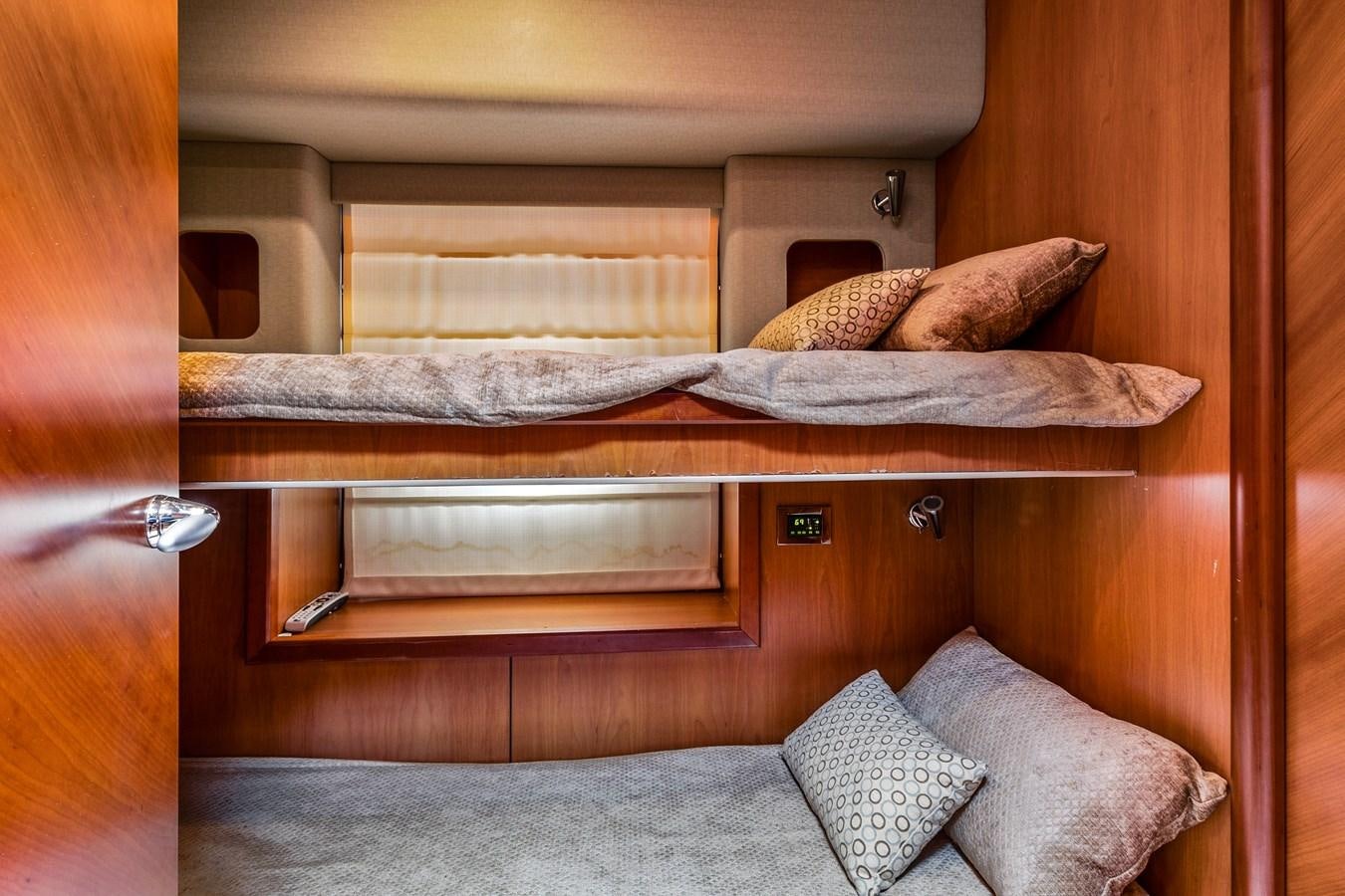 a bed with pillows aboard HER WAY Yacht for Sale