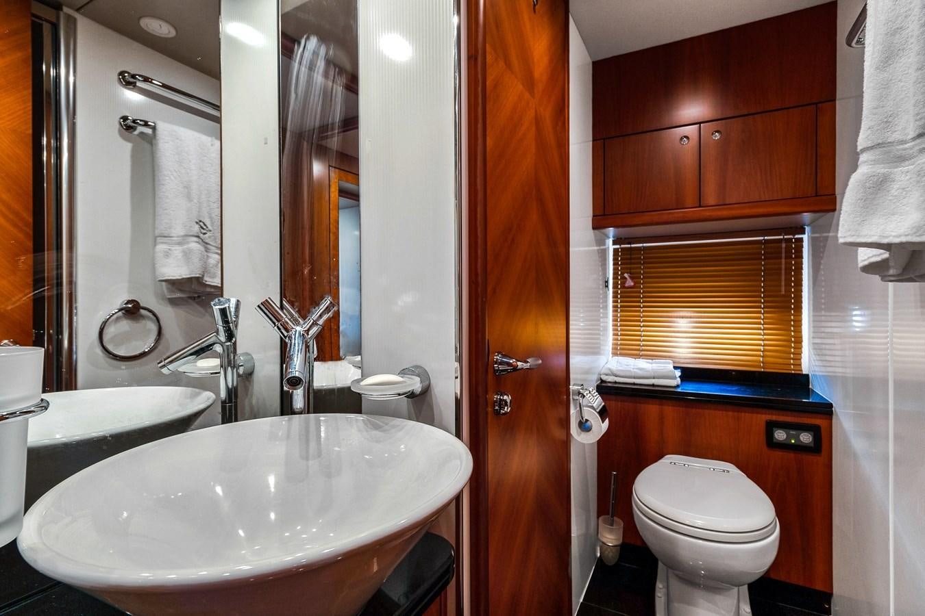 a bathroom with a sink toilet and a bathtub aboard HER WAY Yacht for Sale