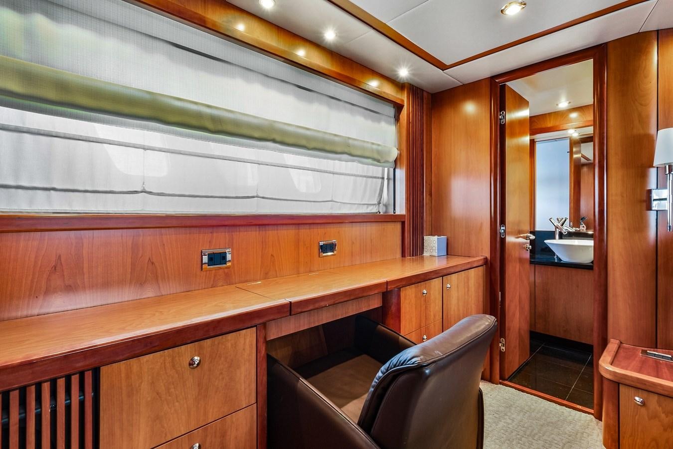 a room with a bench and a chair aboard HER WAY Yacht for Sale