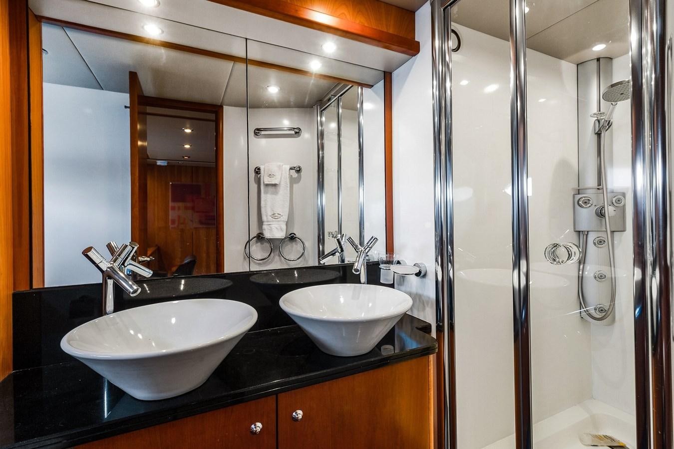 a bathroom with a sink and a shower aboard HER WAY Yacht for Sale