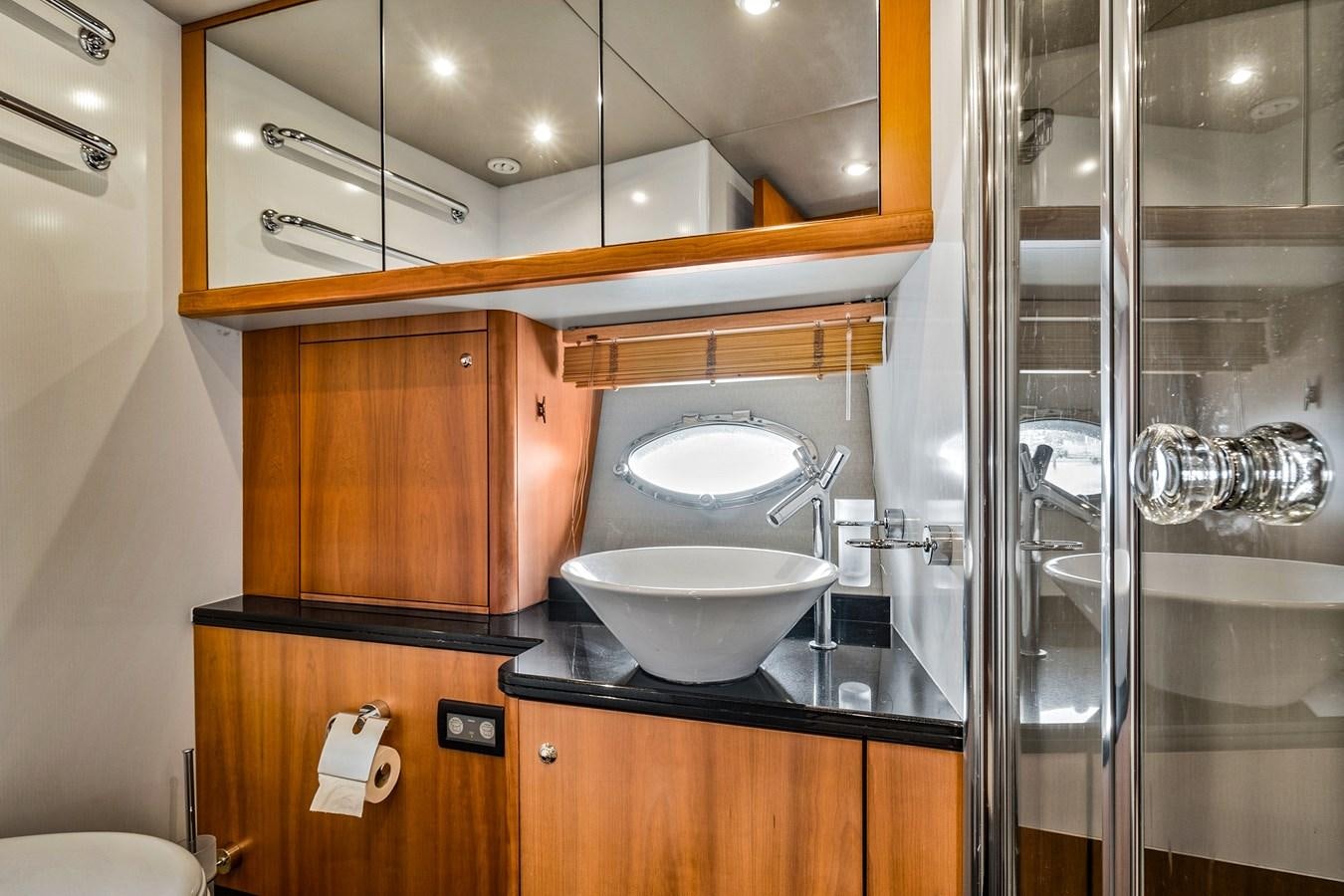 a sink and a mirror in a bathroom aboard HER WAY Yacht for Sale