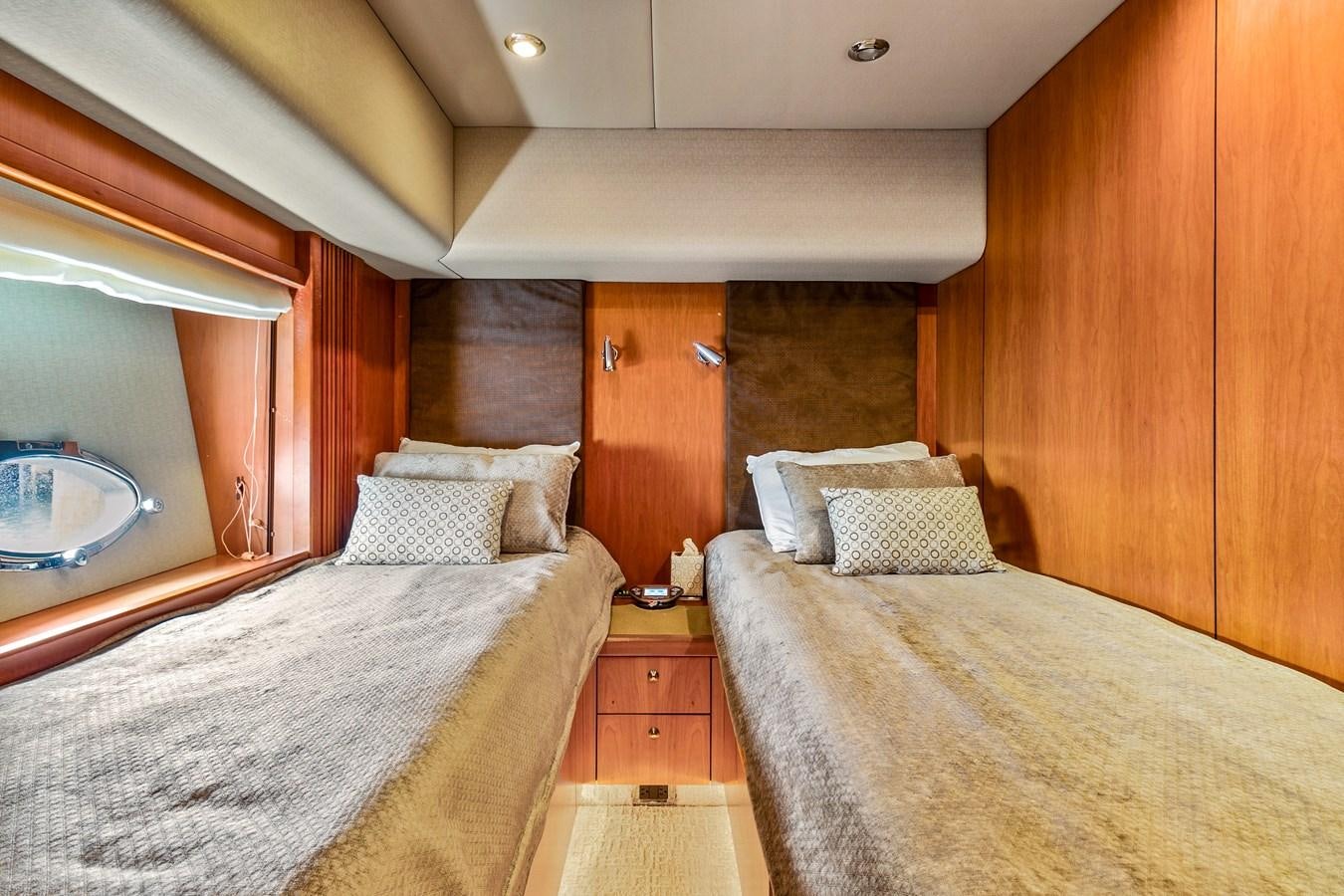 a bedroom with two beds aboard HER WAY Yacht for Sale