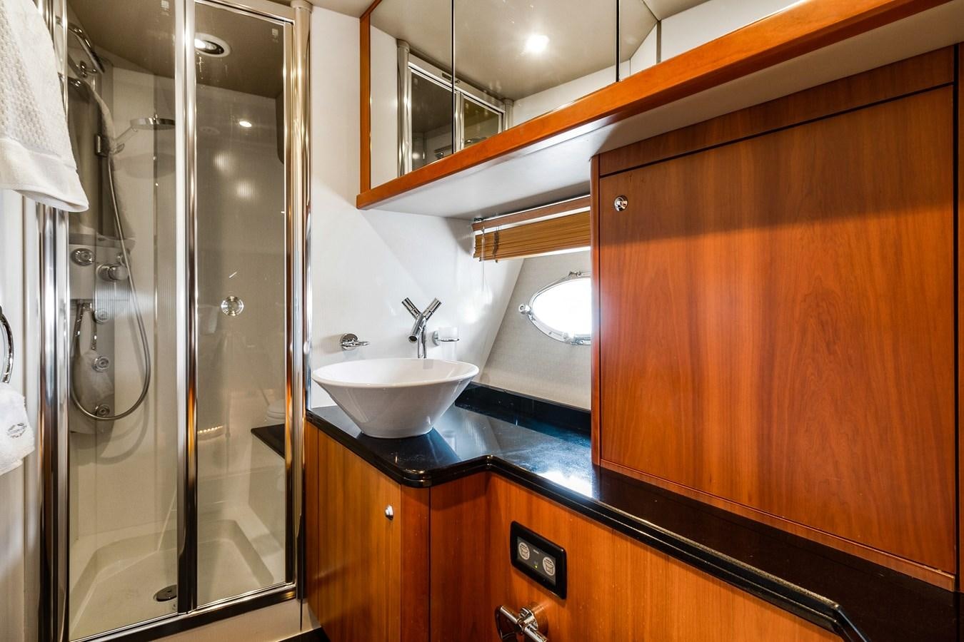 a bathroom with a sink and a shower aboard HER WAY Yacht for Sale