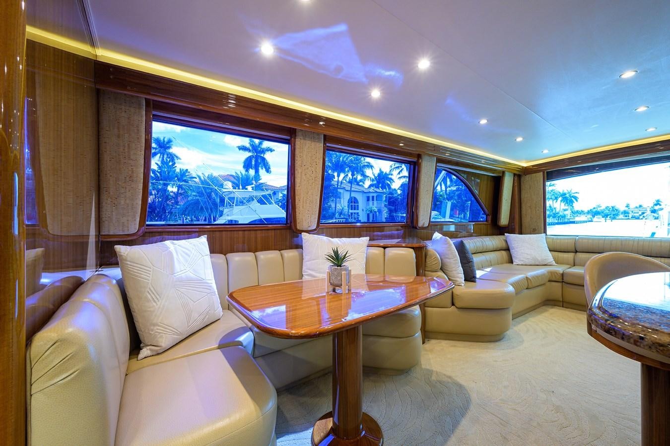 a living room with a table and chairs aboard KNOT RACING Yacht for Sale