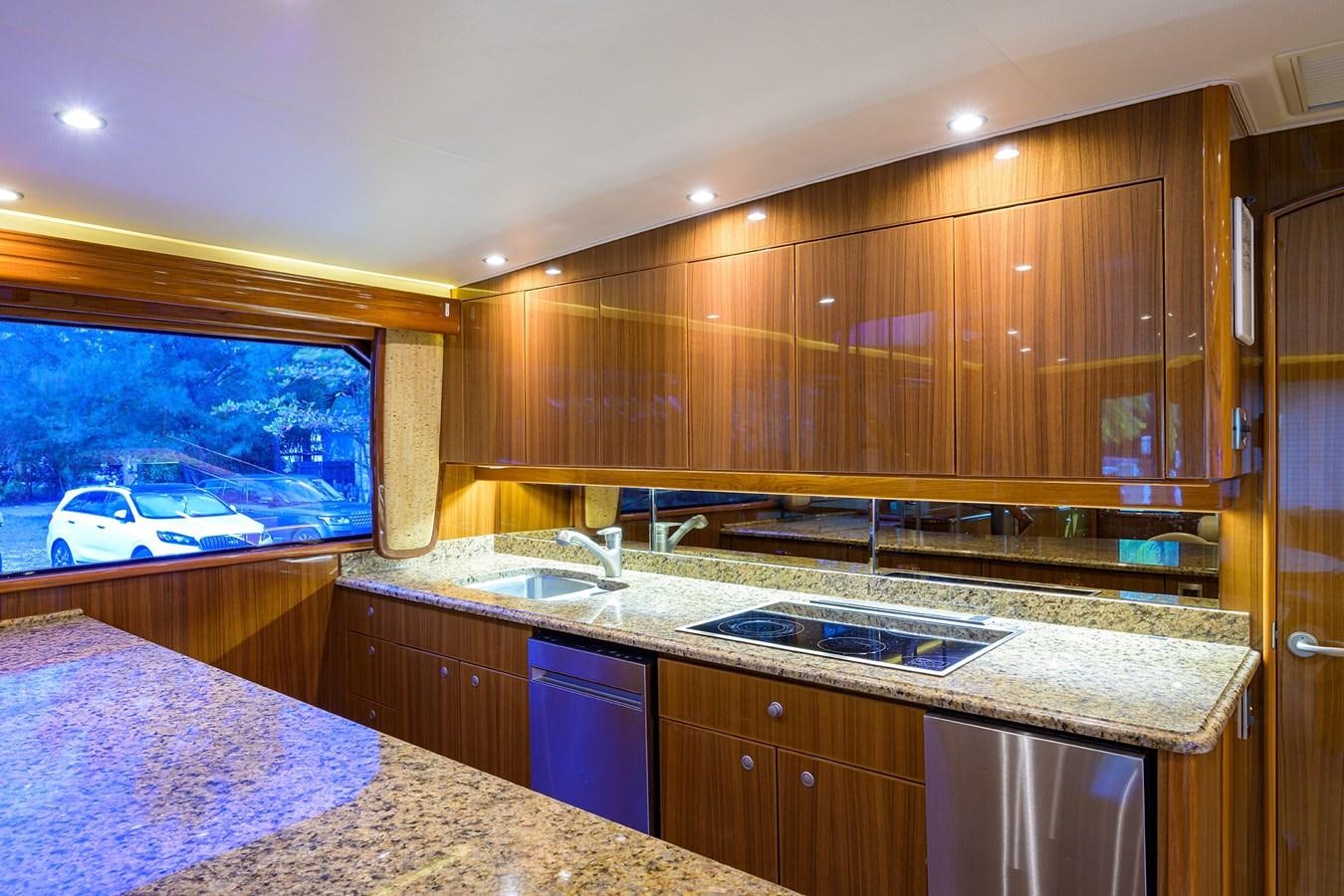 a kitchen with a large window aboard KNOT RACING Yacht for Sale