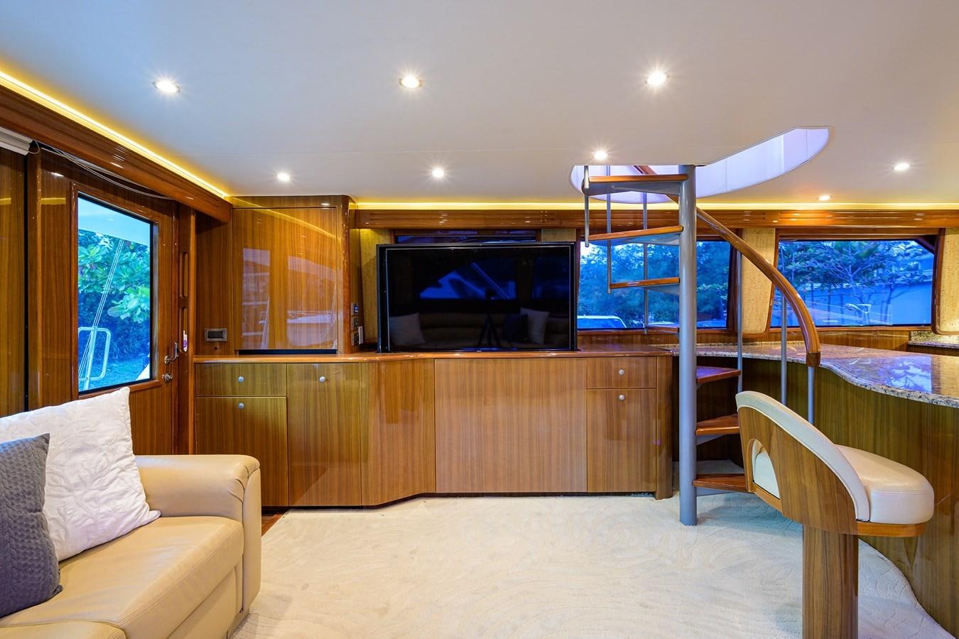a room with a tv and bunk beds aboard KNOT RACING Yacht for Sale