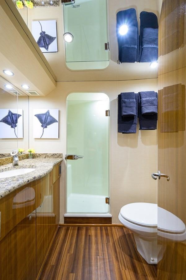 a bathroom with a toilet and a sink aboard KNOT RACING Yacht for Sale