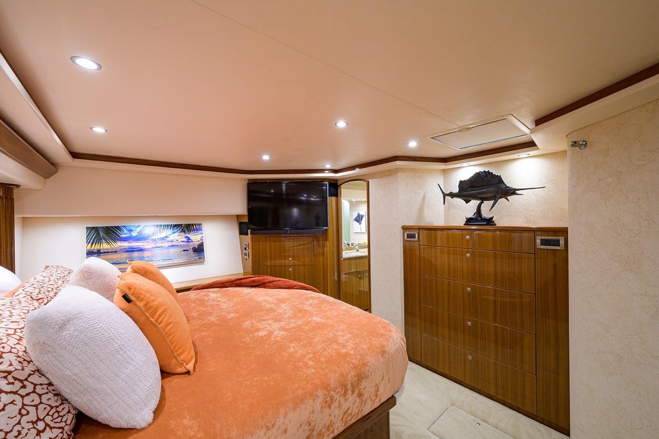 a bedroom with a bed and a closet aboard KNOT RACING Yacht for Sale