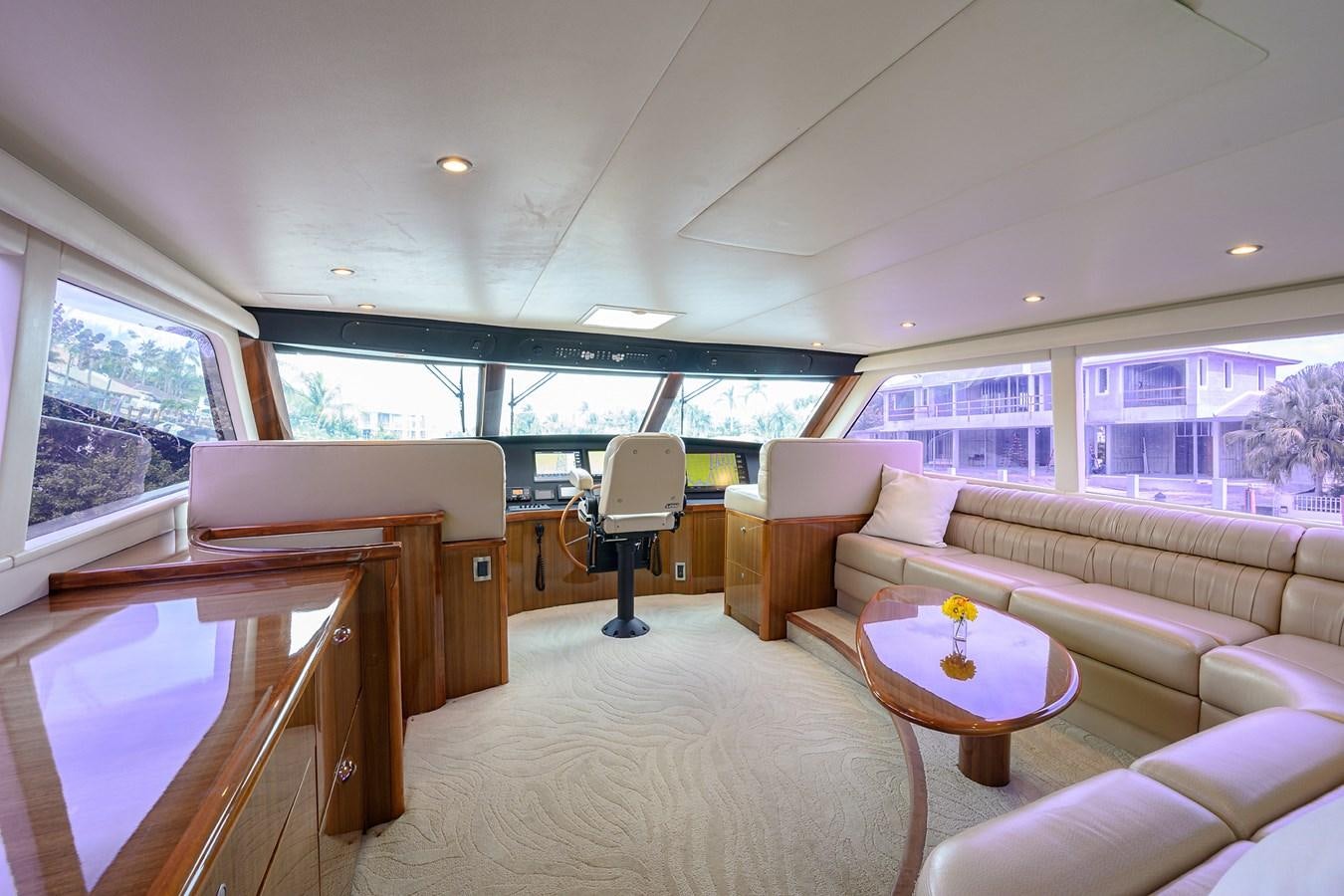 a living room with a large window aboard KNOT RACING Yacht for Sale
